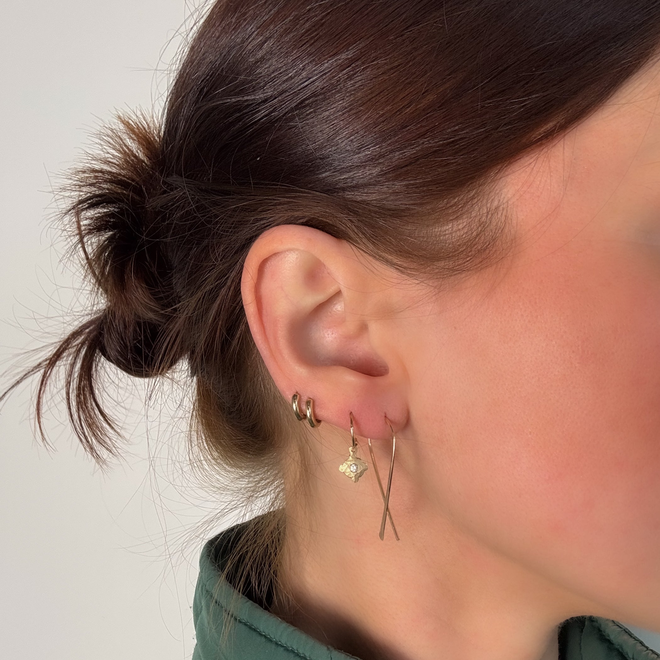 modeled small fish earrings by glacier lily