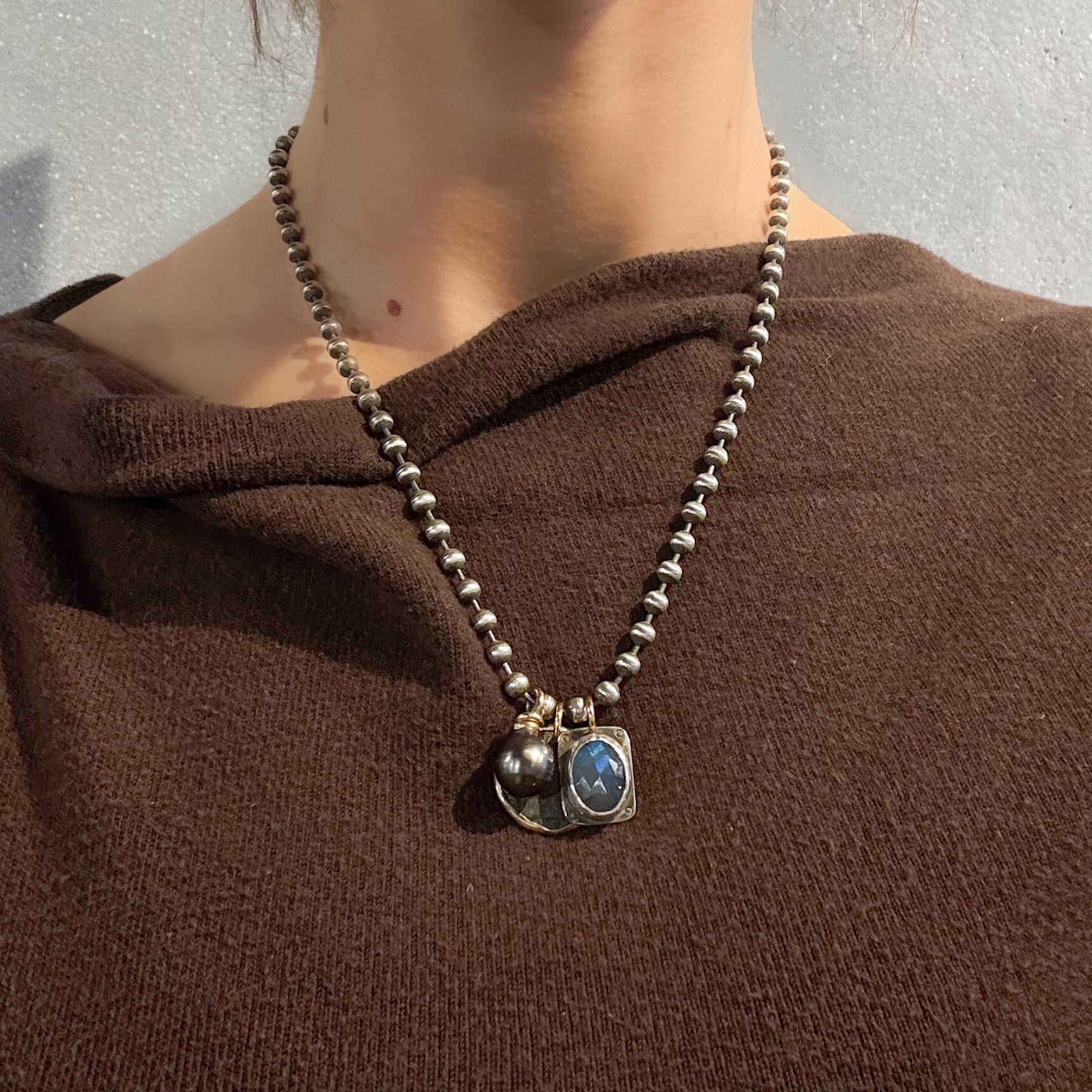 Roman coin necklace by glacier lily shown on model