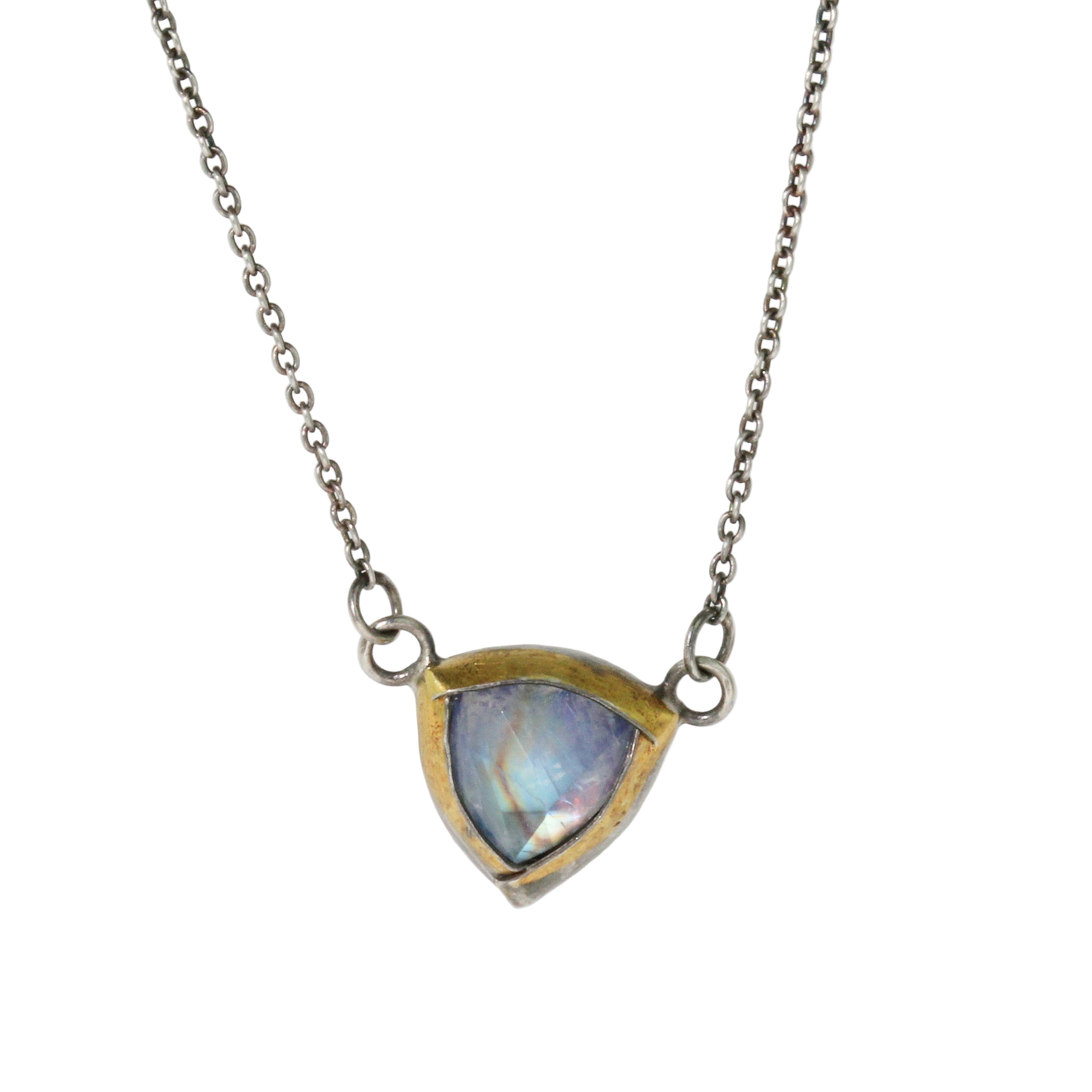 Necklace with a white/blue gemstone pendant on a white background