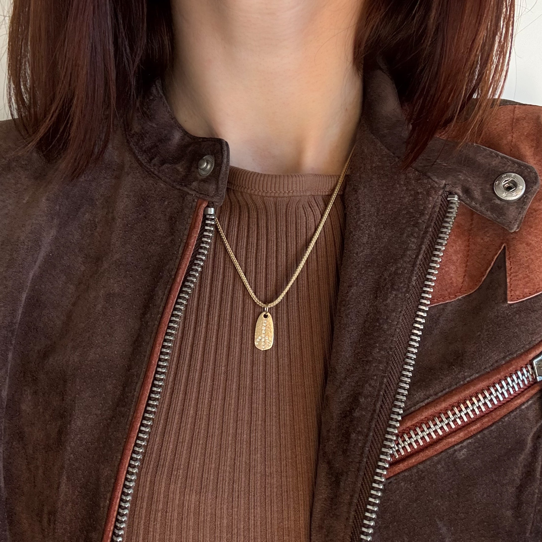 Victoria-Cunningham-diamond-peace-necklace Modeled 