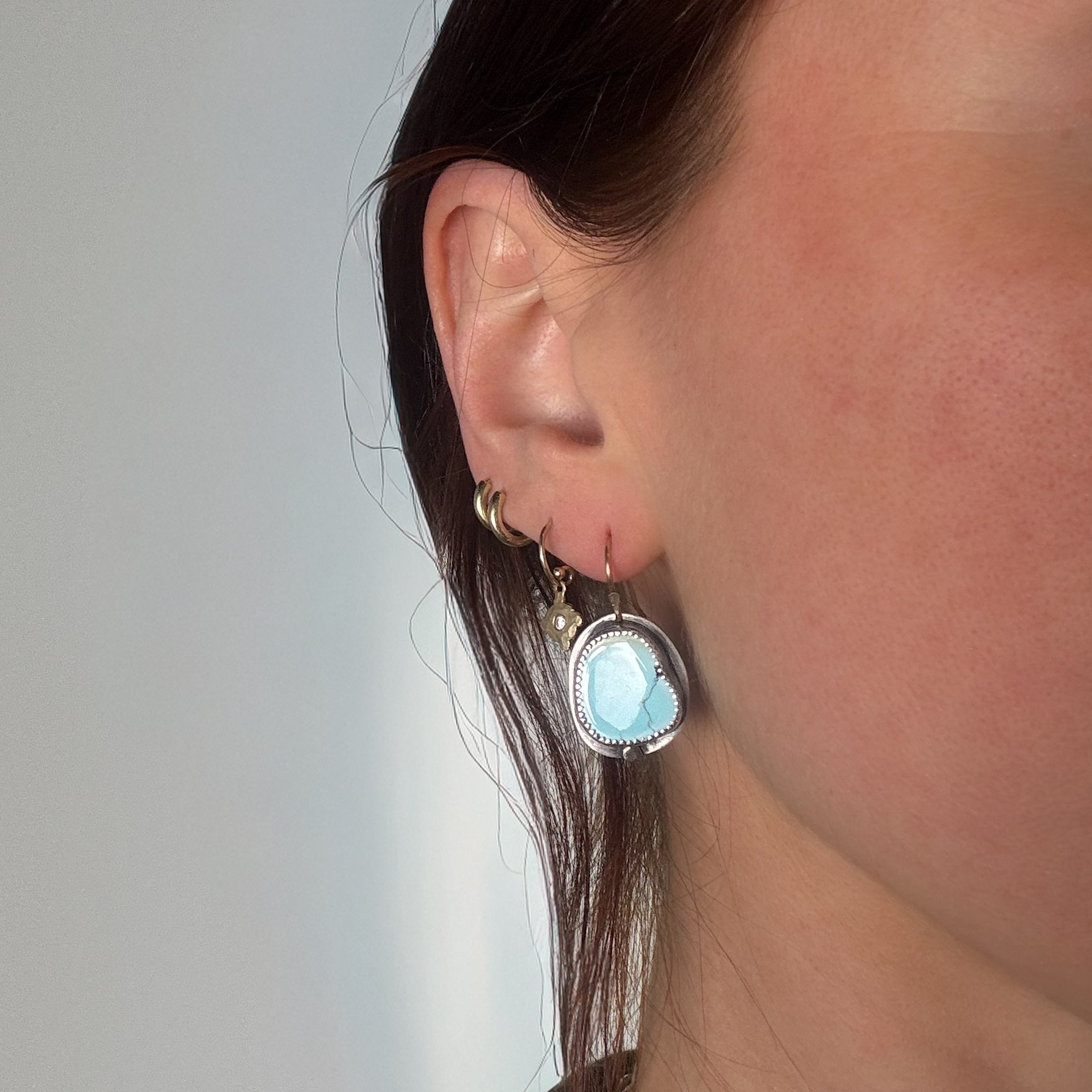 glacier lily turquoise drop earrings modeled on a woman 