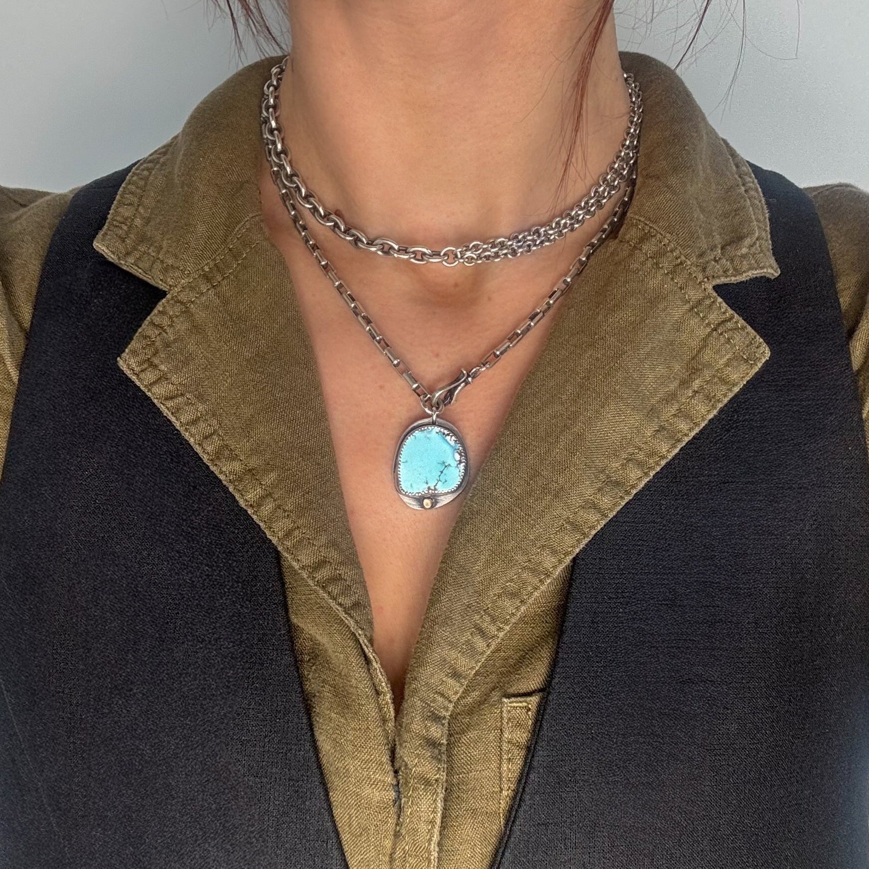 Glacier lily chunky turquoise necklace layered with another chunky choker chain